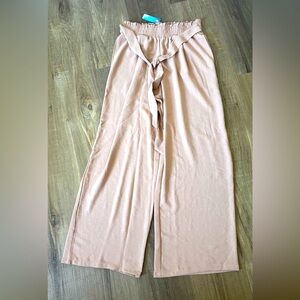 Women’s cream wide-leg pants.